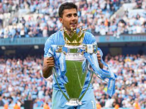 Rodri holding a trophy